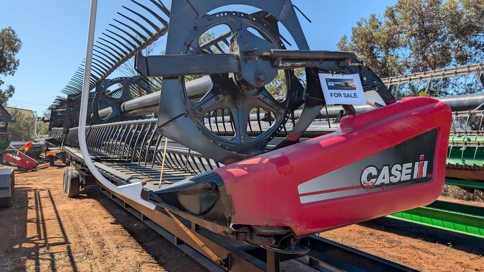 MacDon D60 40ft draper front, front view showing the reel and red Case IH 2152 end shield