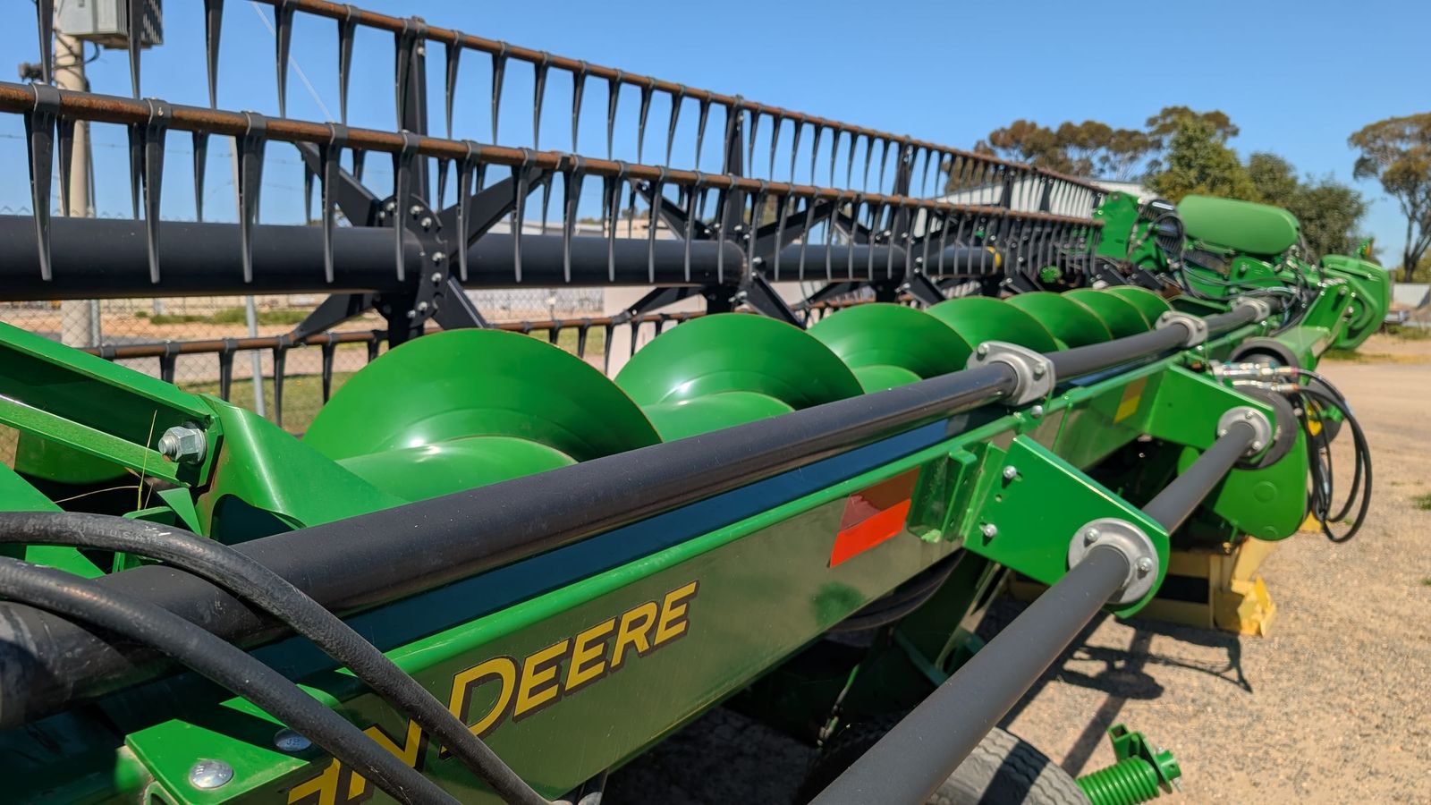 John Deere 740D 40ft flex draper front, close view of the reel and cutterbar