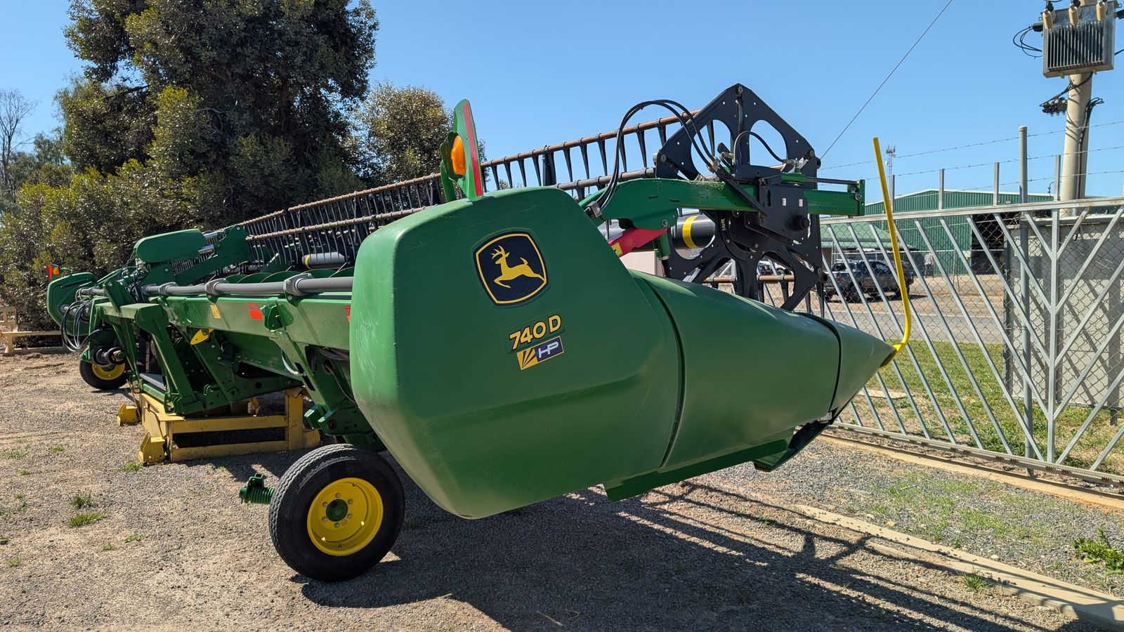 John Deere 740D 40ft flex draper front, end shield carrying the 740D model decal