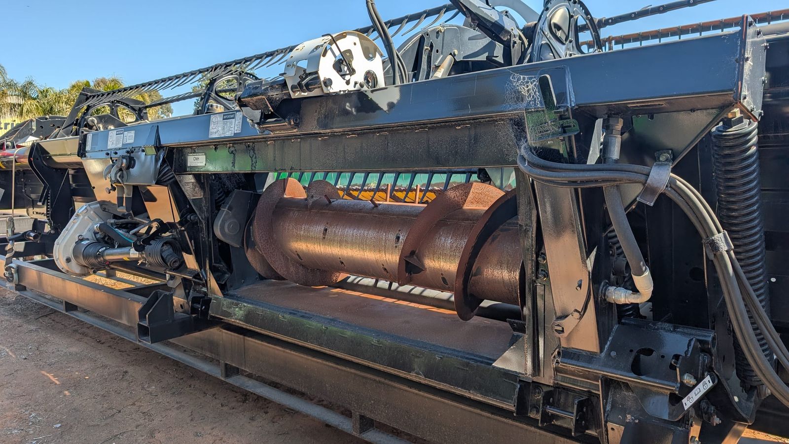 MacDon D60 40ft draper front, feed auger and adapter viewed from the rear