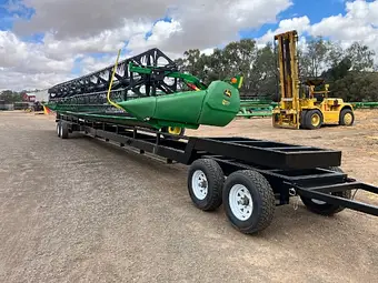 John Deere 740D 40ft flex draper front — reel and knife bar detail