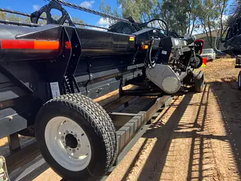 MacDon D60 40ft — rear quarter showing drive end and trailer wheels