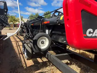 MacDon D60 40ft — adapter and drive end on comb trailer
